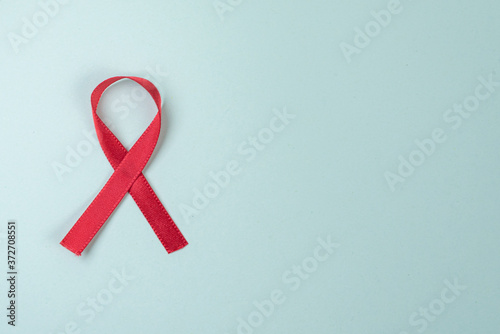 Red ribbon on green background