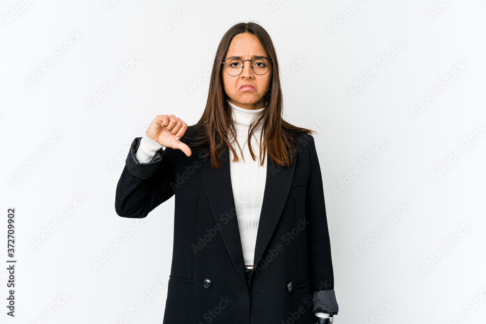 Young mixed race business woman isolated on white background showing a dislike gesture, thumbs down. Disagreement concept. Young mixed race business woman isolated on white background showing a dislike gesture, thumbs down. Disagreement concept.