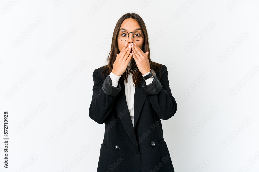 Young mixed race business woman isolated on white background shocked covering mouth with hands. Young mixed race business woman isolated on white background shocked covering mouth with hands.
