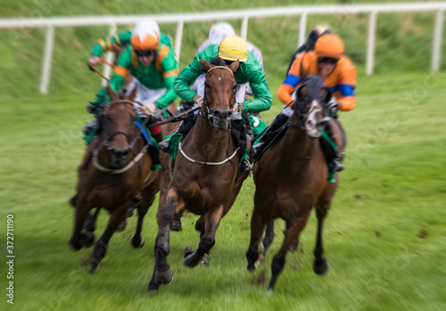 Close up on lead race horse and jockey speeding towards the finish line, fast motion blur effect