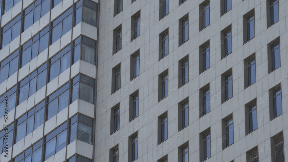 Generic day time establishing exterior apartment building in urban city.