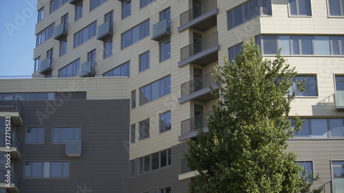 Residential building in New microdistrict. Close up Of An Apartment Blocks. The building features exterior with small balconies