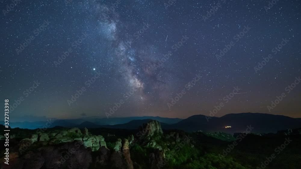 Amazing night time lapse with Milky Way galaxy, traffic lights, plane trails and meteor shower, during Perseid Stream over picturesque rock formation, Belogradchik rocks, Bulgaria Amazing night time lapse with Milky Way galaxy, traffic lights, plane trails and meteor shower, during Perseid Stream over picturesque rock formation, Belogradchik rocks, Bulgaria