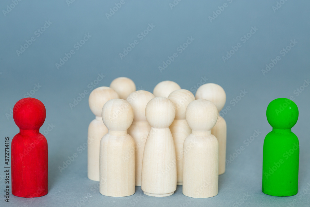 An election concept of a group of people sitting on the fence unsure about whether to vote yes or no in an election or ballot