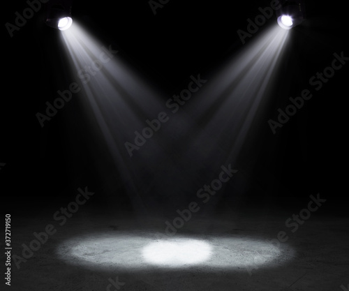 2 stage spotlights on dark background.