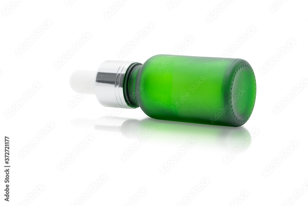 Green glass dropper serum bottle on white background Green glass dropper serum bottle on white background