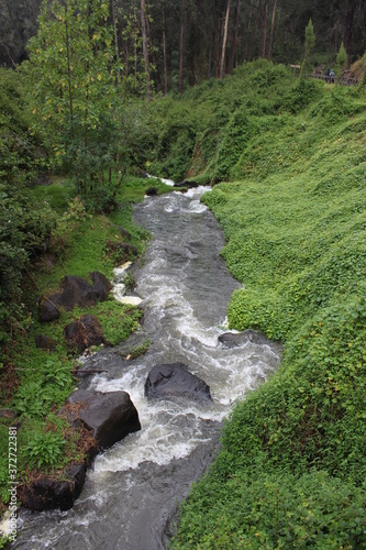 VIEW OF A RIVER AND WATERFALL