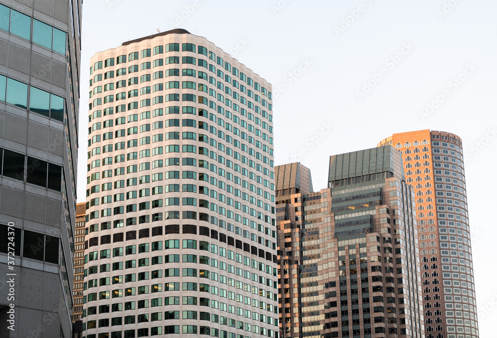 Office buildings and luxury real estate in downtown Boston near the Seaport district and on the harbor.