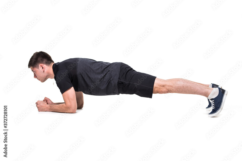 Young man on abdominals workout Basic Plank posture on white background