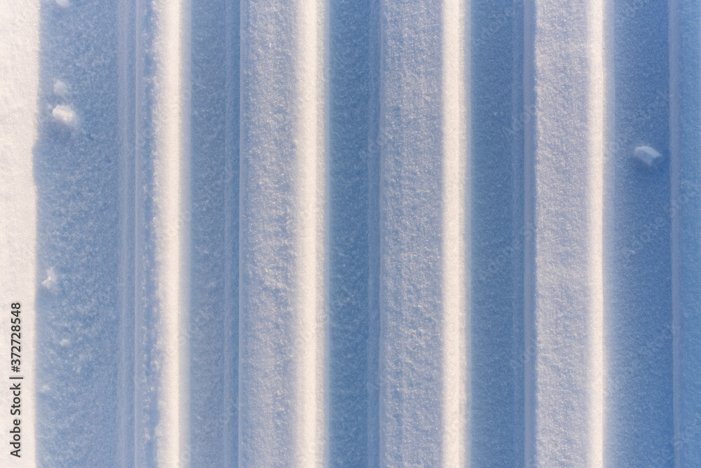 Photography Abstract texture with vertical sled trail on snow