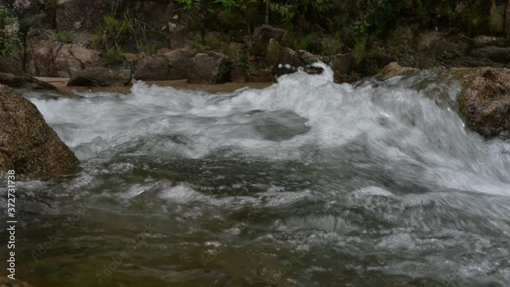 Fresh water flowing through the rock at the waterfall Fresh water flowing through the rock at the waterfall