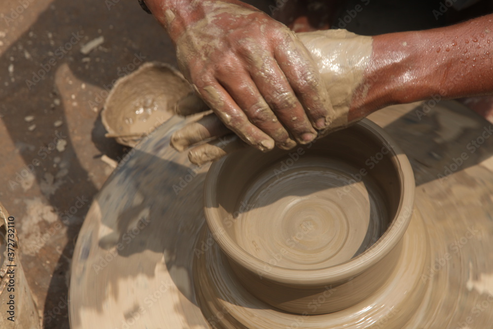 Potter at work, clay molding, man work clay, potter man Potter at work, clay molding, man work clay, potter man
