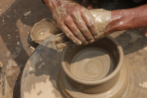 Potter at work, clay molding, man work clay, potter man
