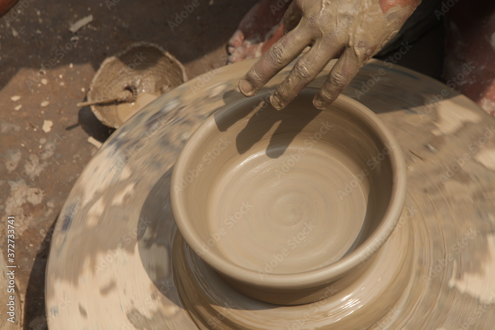 Fototapeta premium Potter at work, clay molding, man work clay, potter man