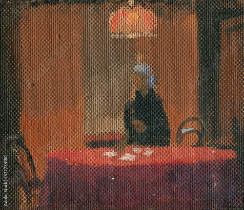 Fotografie Oil sketch on cardboard of old woman sitting at round table in her room in eveni