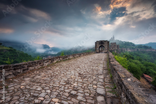 Beautiful view with spring morning mists in front of the main gate of the Tzarevetz fortress, Veliko Tarnovo, Bulgaria photo