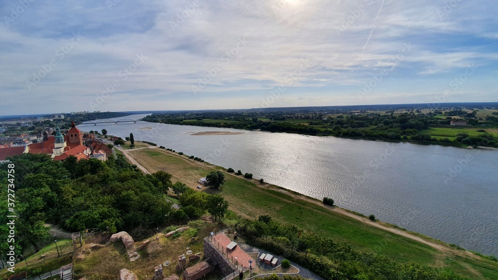 Vistula River flowing through the city of Grudziadz. Vistula River, largest river of Poland and of the drainage basin of the Baltic Sea.