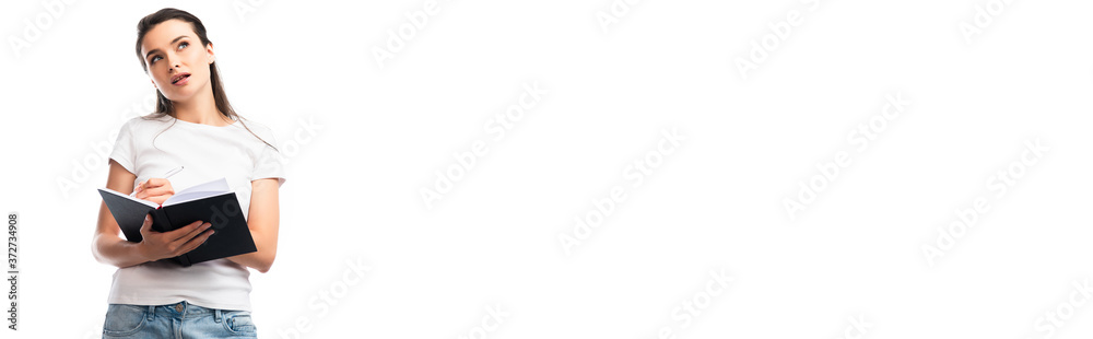 panoramic orientation of thoughtful woman in white t-shirt holding notebook and pen isolated on white panoramic orientation of thoughtful woman in white t-shirt holding notebook and pen isolated on white