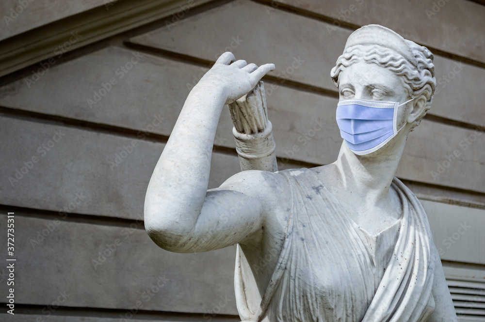 Statue with medical mask against the covid in Buenos Aires, Argentina