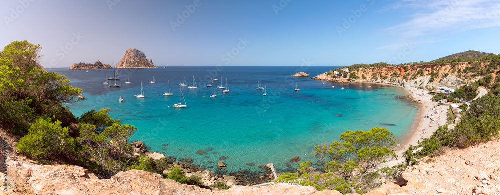 Super panorama of beautiful beach Cala Hort and the mountain Es Vedra. Ibiza, Balearic Islands, Spain