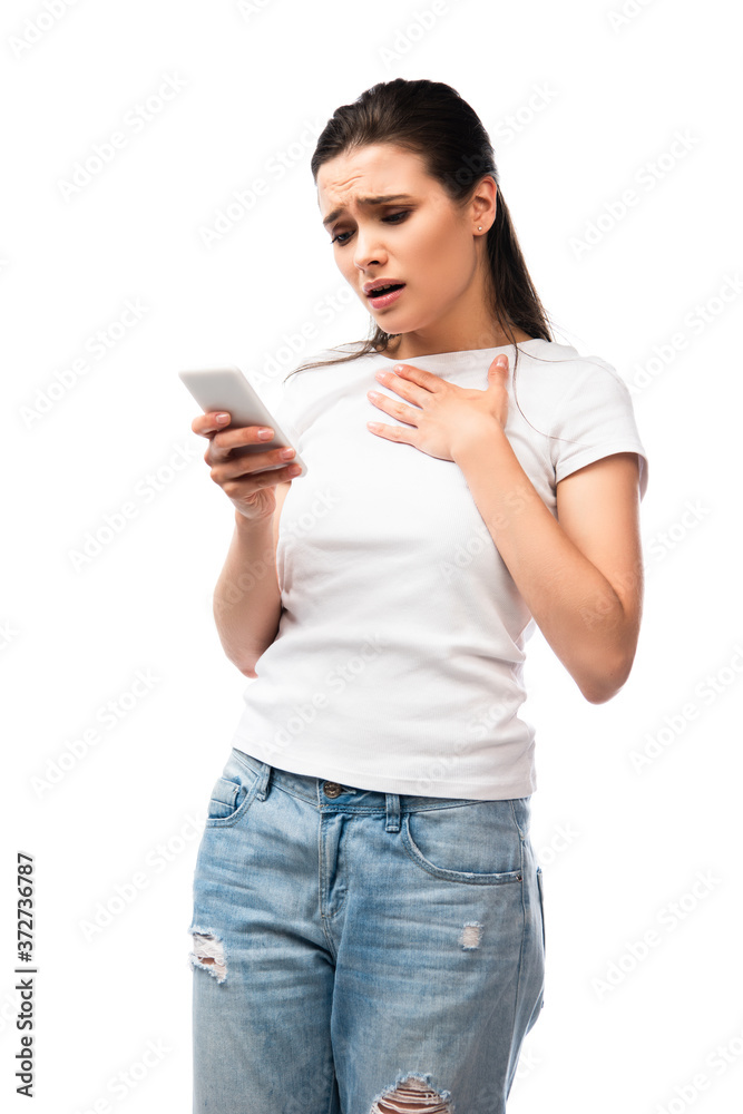 worried young woman looking at smartphone isolated on white worried young woman looking at smartphone isolated on white