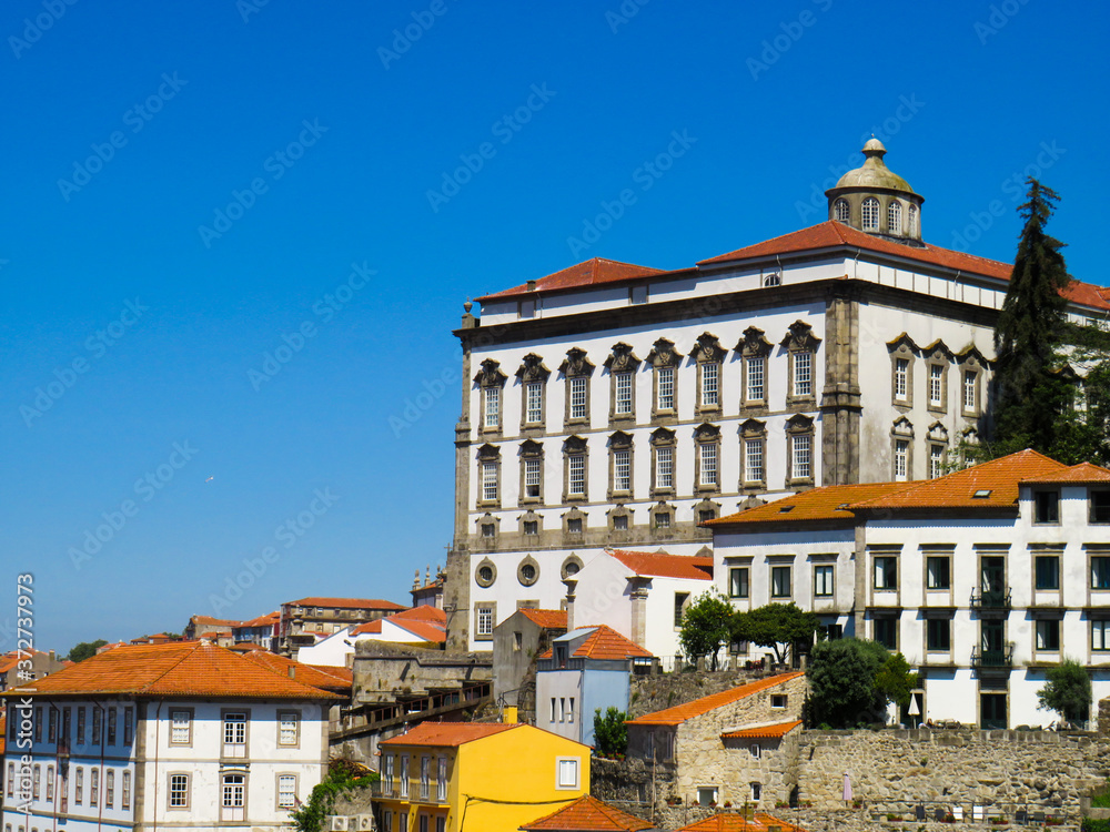 Porto, Portugal - July 18, 2019: Episcopal Palace and other buildings in the Historic Center of Porto.