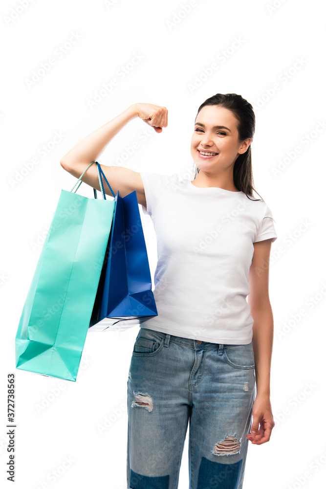 young woman looking at camera and holding shopping bags isolated on white young woman looking at camera and holding shopping bags isolated on white