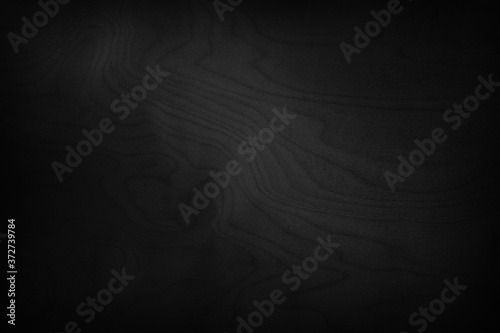 Black and white background. Dark wood background with light effect. Black wood texture. Beautiful vintage wood plank pattern.