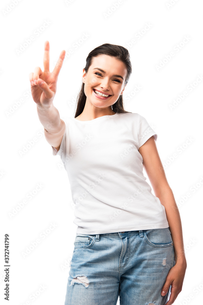 selective focus of brunette woman in white t-shirt showing peace sign isolated on white selective focus of brunette woman in white t-shirt showing peace sign isolated on white