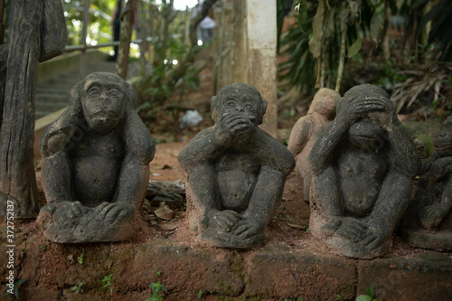 Three statues of monkeys. Symbolism with the concept of not seeing evil  not hearing evil  not speaking evil.