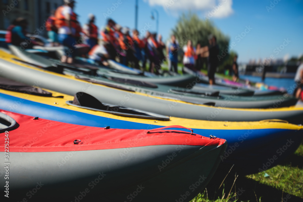 A process of kayaking in the city river canals, with colorful canoe kayak  boat paddling, process of canoeing, group of kayaks Stock Photo | Adobe  Stock