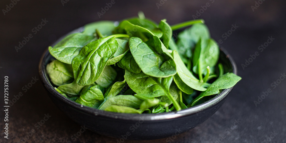 spinach green juicy leaves organic salad serving size natural product top view copy space for text keto or paleo diet raw spinach green juicy leaves organic salad serving size natural product top view copy space for text keto or paleo diet raw
