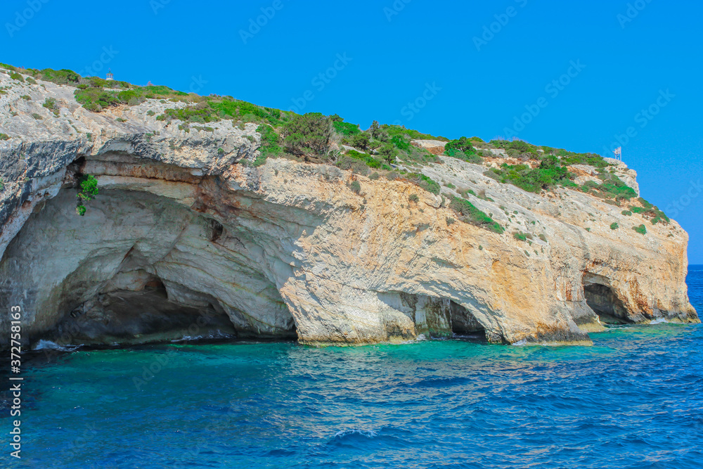 Blue caves on the island of Zakynthos in Greece. Stunning scenery. Ionian sea. Boat trip around the island. Mediterranean.