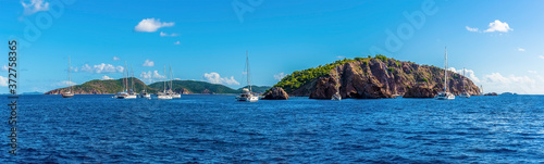A panorama view sailboats moored of the Pelican Island and the Indian Islets off the main island of Tortola