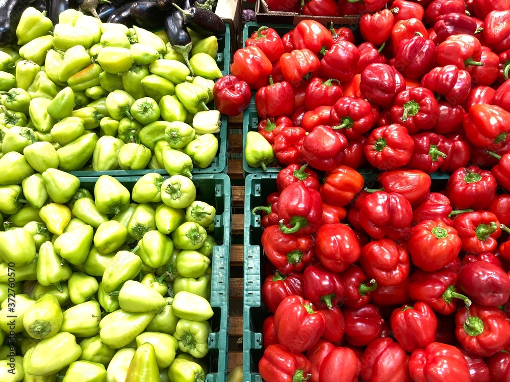 Ripe red and green peppers in a box. Fresh bell peppers in a box Ripe red and green peppers in a box. Fresh bell peppers in a box