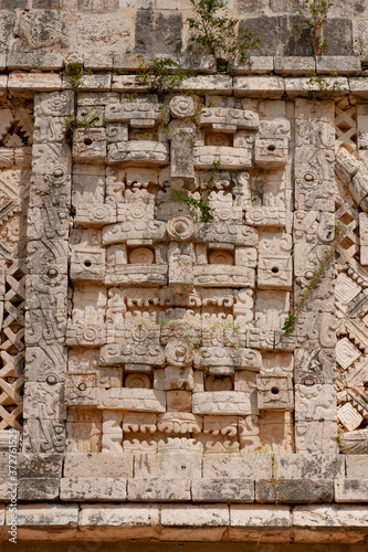 Detail of an pyramid at Uxmal an Mayan arqueological zone at Yucatan, Mexico. photo