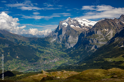 A high angle view of  the village of Grindelwald and the Wetterhorn in the Swiss Alps. © Bob