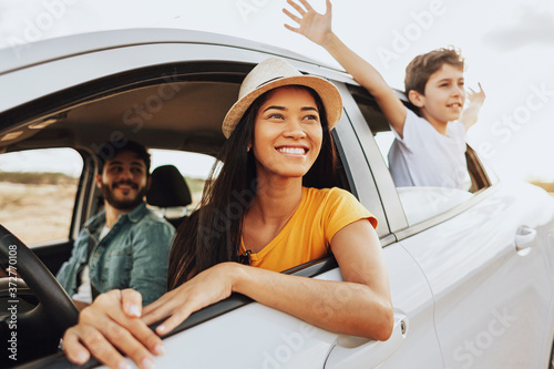 Family road trip. Latin family traveling locally by car.