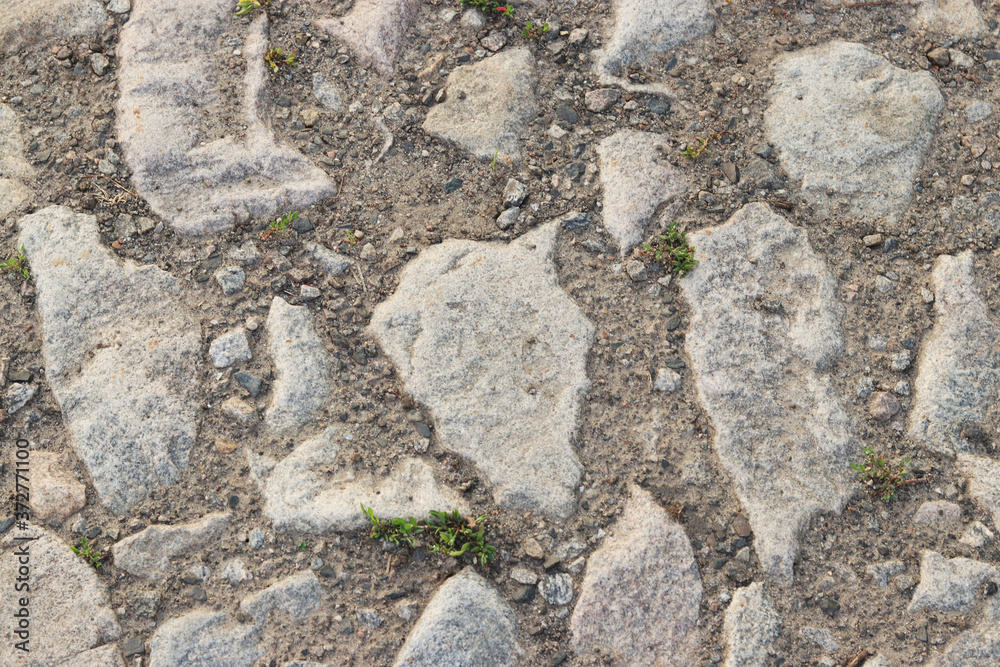 Road from granite stones as a background, Horizontal orientation Road from granite stones as a background, Horizontal orientation