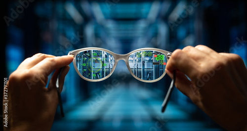 Augmented reality glasses. Smart glasses in the hands of a man. Nanotechnology. A look into the future. Augmented reality.