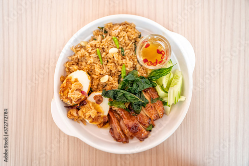 Spicy rice with chicken roasted, egg and vegetable