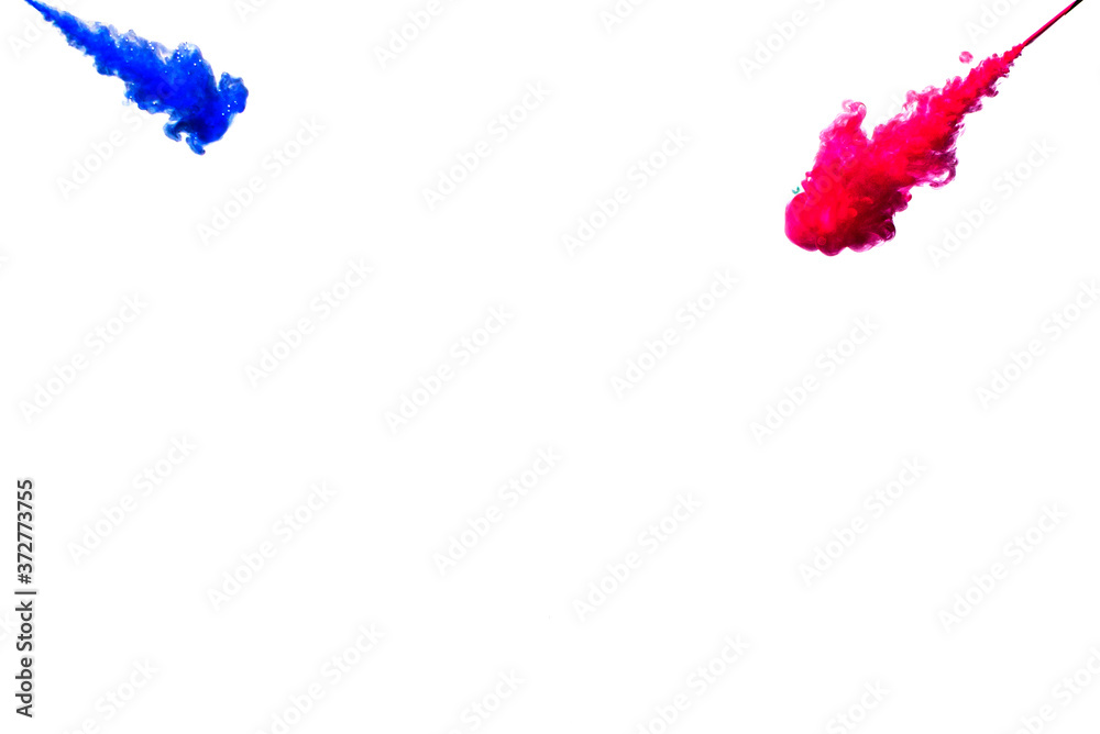 A cloud of pink and blue paint released into clear water. Isolate on a white background. A cloud of pink and blue paint released into clear water. Isolate on a white background.
