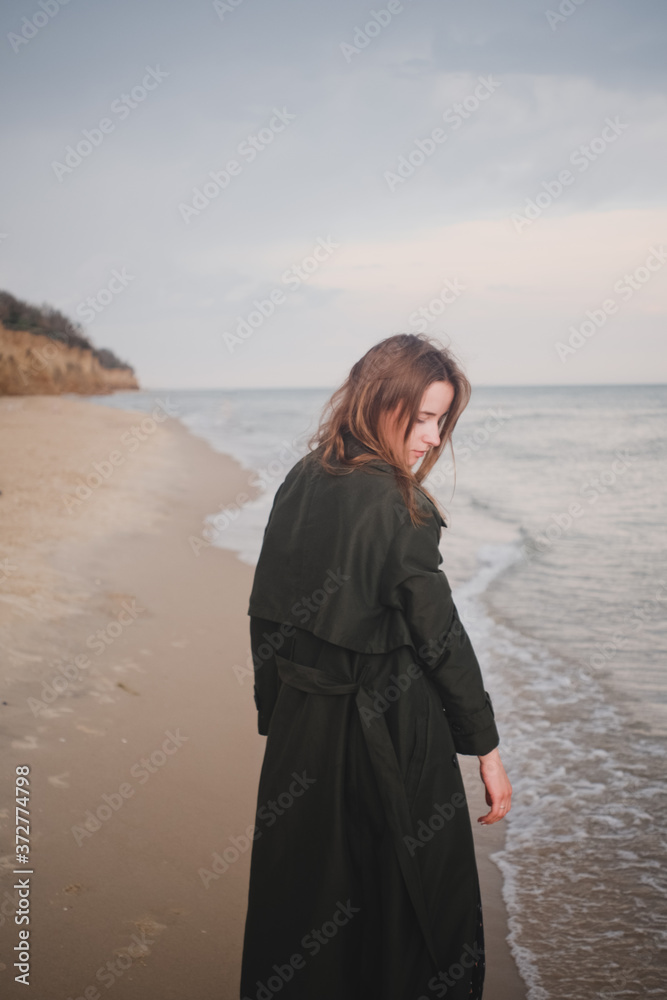 Amazing Fashion Girl Walking on a Sea Beach