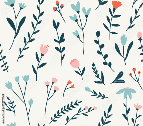 Seamless pattern of different flowers pink, blue, and red flowers background elements.