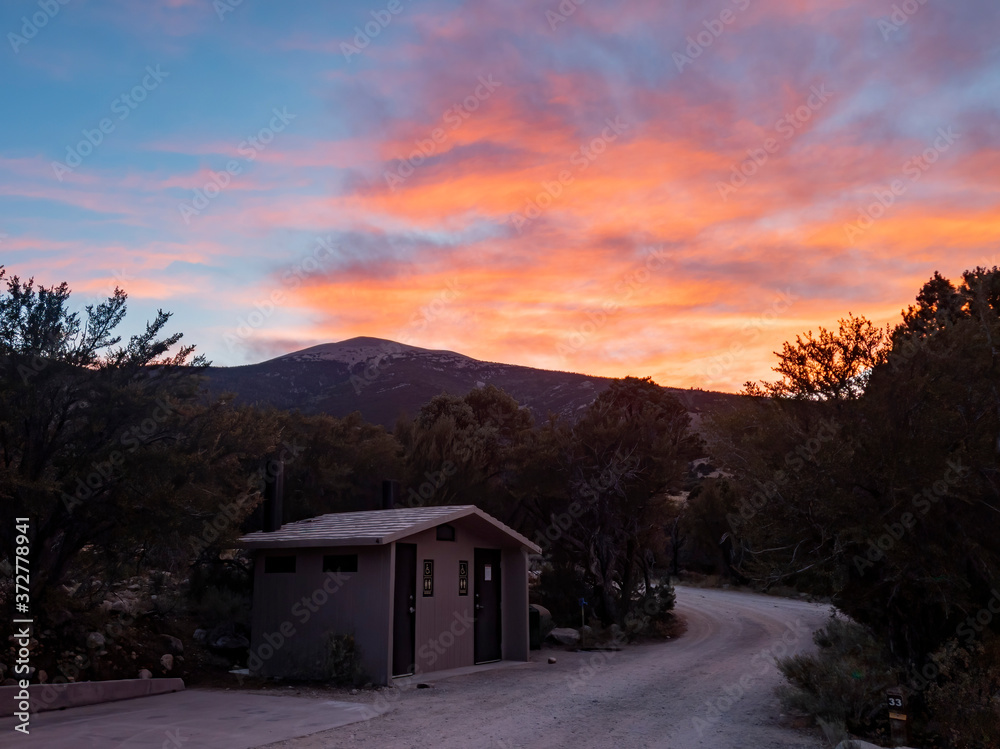 Sunset with beautiful afterglow with a toilet in the campground Sunset with beautiful afterglow with a toilet in the campground