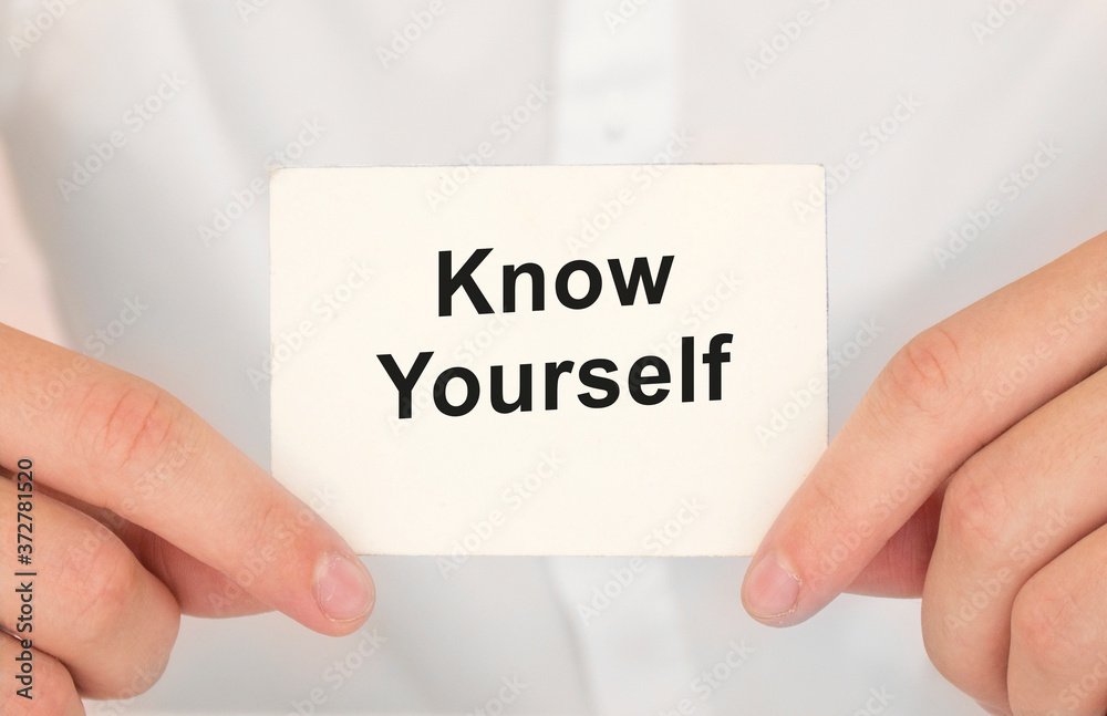 Man's hands take a card with words Know yourself, finance and business concept. Man's hands take a card with words Know yourself, finance and business concept.