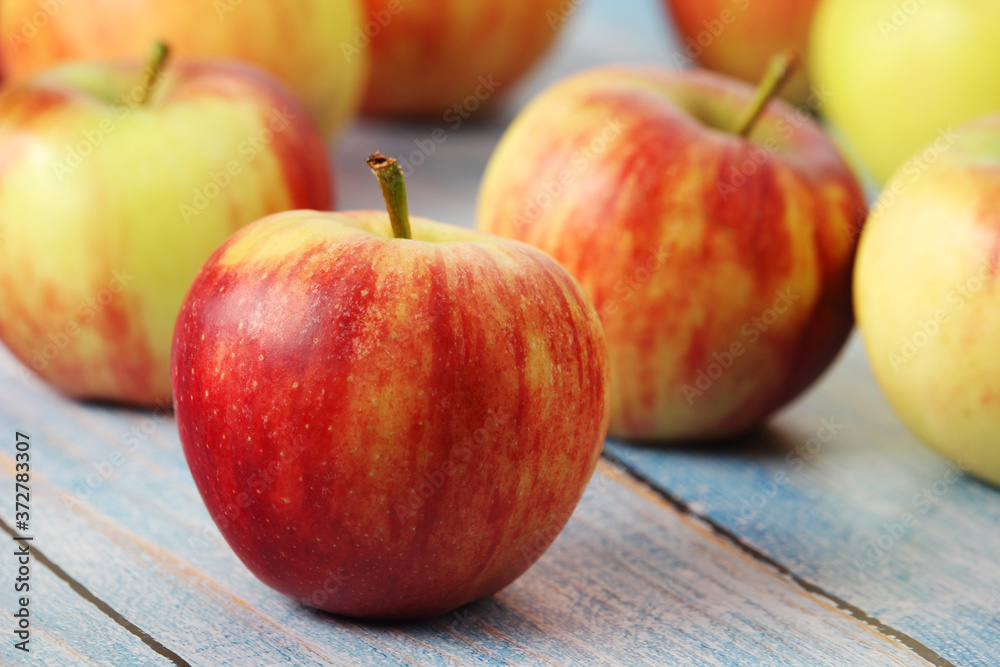 Several ripe red apples on the wooden table Several ripe red apples on the wooden table