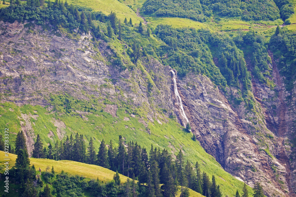 The panorama of a waterfall in Rapperalp valley, Bavaria, Germany