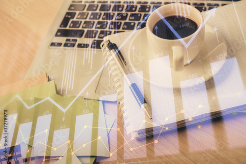 Wallpaper Mural Double exposure of forex chart drawing and desktop with coffee and items on table background. Concept of financial market trading Torontodigital.ca