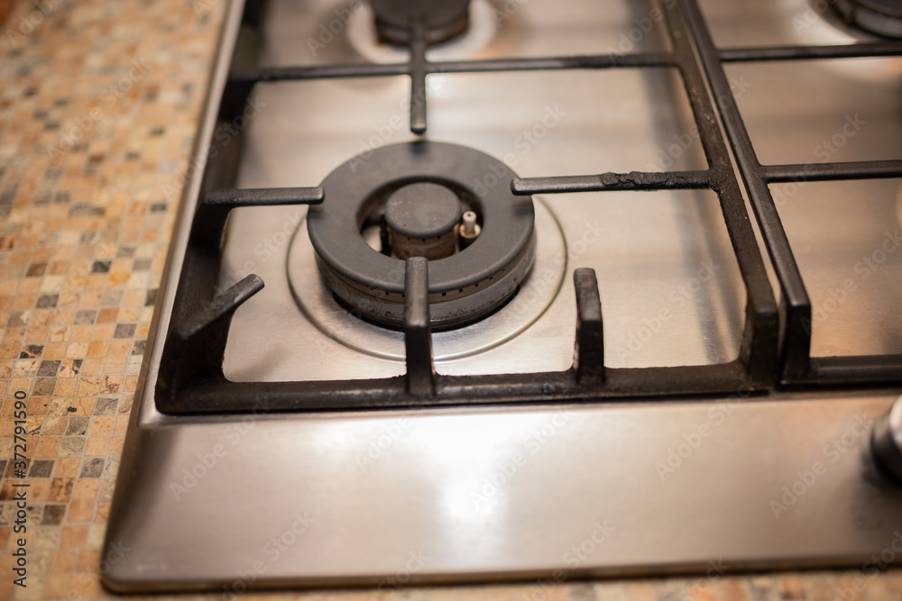 Dirty gas stove stained while cooking, a stove in grease. Unsanitary conditions, a mess in the house. Dirty gas stove stained while cooking, a stove in grease. Unsanitary conditions, a mess in the house.